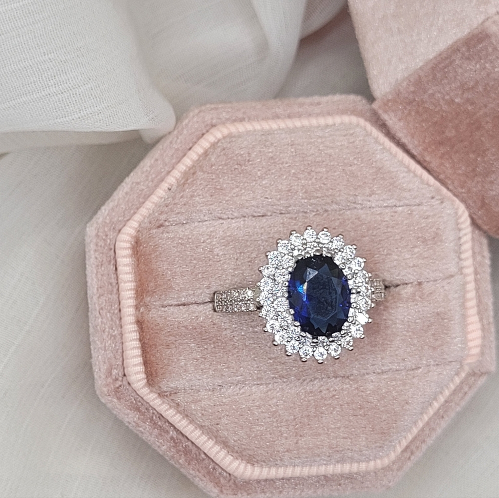 Timeless Oval Blue Sapphire Halo Ring in Sterling Silver